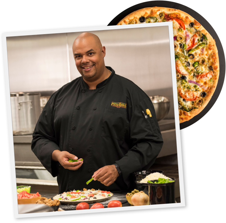 head chef preparing a pizza